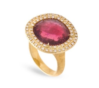 A gold fashion ring from Marco Bicego features a ruby center gemstone.