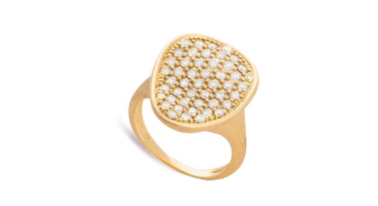 a yellow gold statement ring featuring pave set diamonds