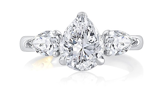 a white gold, three stone engagement ring with three pear shape diamonds