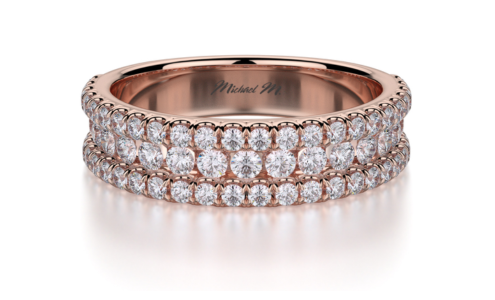 A sparkling rose gold eternity ring from Michael M with three rows of round diamonds, available at Rogers Jewelry Co.