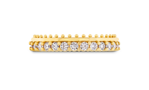 A gold ring from Hearts on Fire adorned with a row of sparkling diamonds, available at Rogers Jewelry Co.
