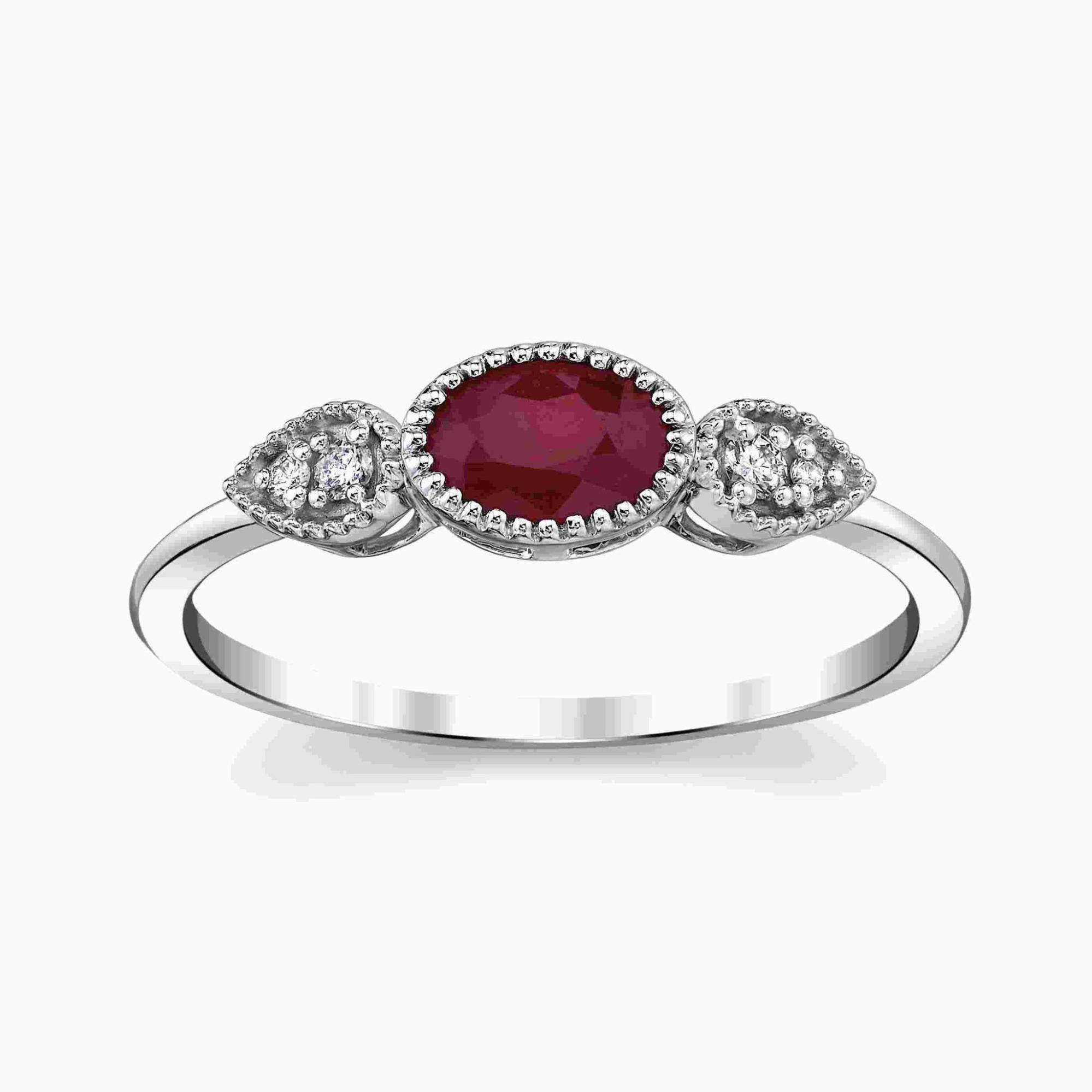 A white gold three stone ruby and diamond fashion ring on a white background
