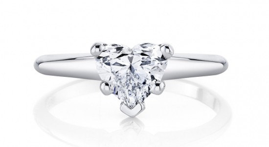a platinum solitaire engagement ring with a heart shaped diamond