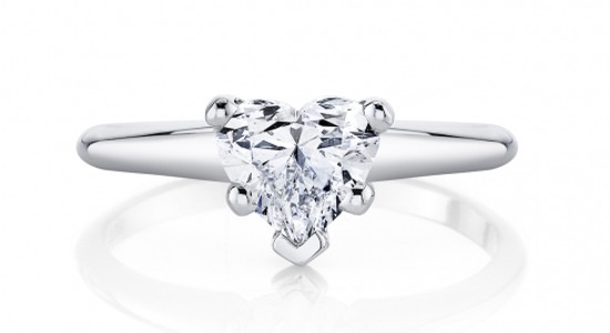 a platinum solitaire engagement ring with a heart shaped diamond