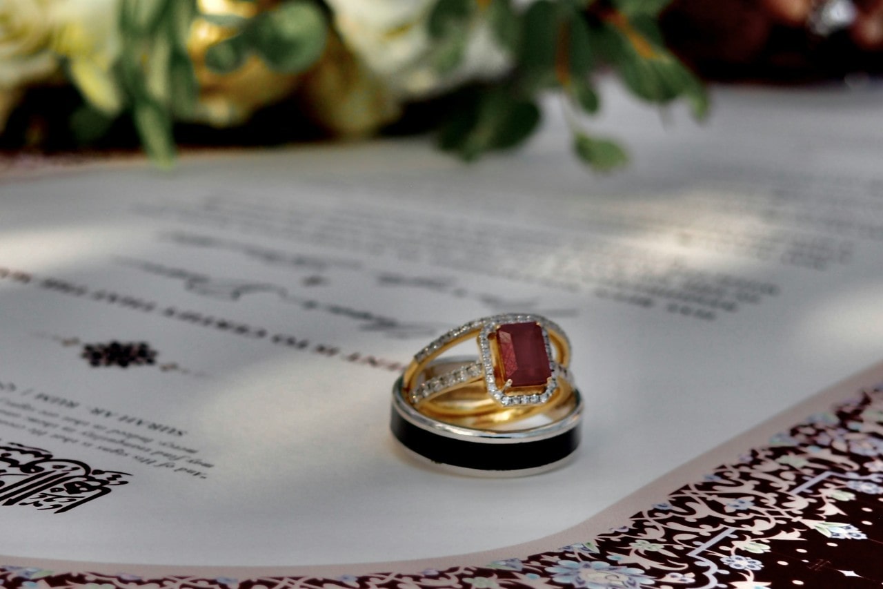 a close up of a custom designed wedding and engagement ring set