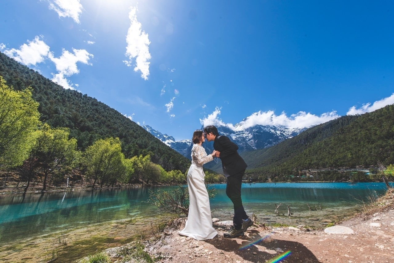 a couple embracing out in the sunlight