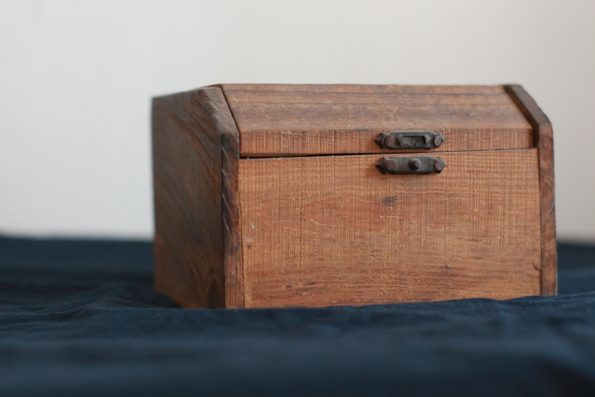 a brown wooden box for keeping jewelry in