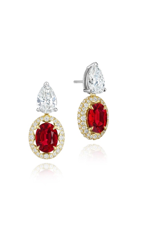 A pair of platinum drop earrings featuring pear-shaped top diamonds and oval ruby drops framed by smaller diamonds.