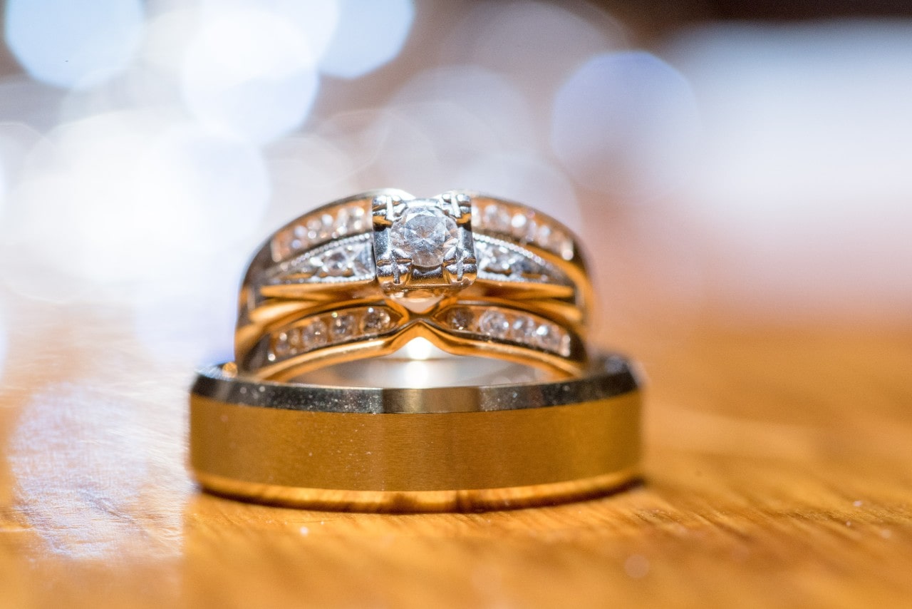 Two radiant wedding bands paired with an engagement ring