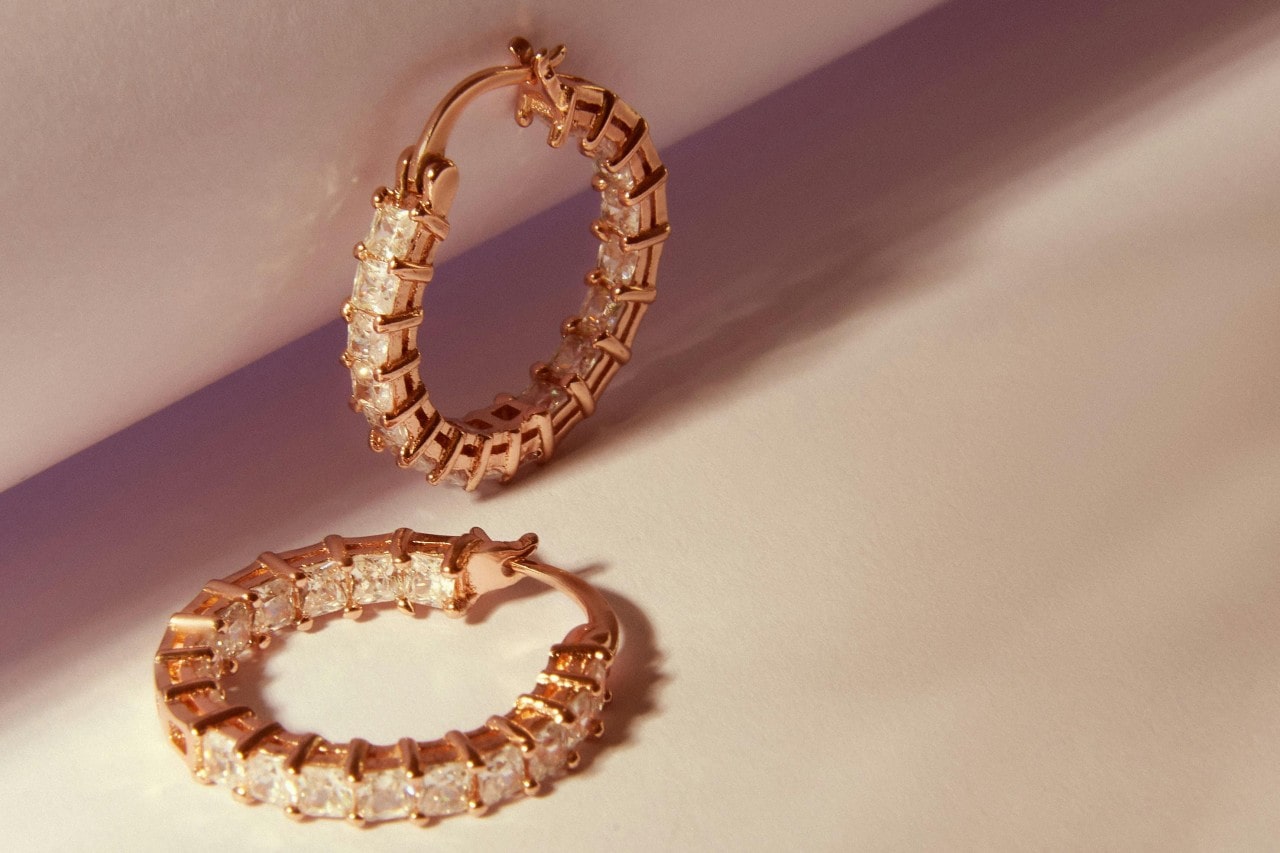 Diamond and yellow gold hoop earrings.