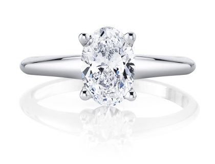 A sleek white gold diamond solitaire ring with an oval cut center stone, available at Rogers Jewelry Co. A sleek white gold diamond solitaire ring with an oval cut center stone, available at Rogers Jewelry Co.